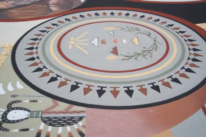Una alfombra de mndala de la
                                cultura de los Navajos en amarillo, rojo
                                y negro