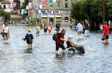 Flood in Switzerland of 2005
                          in Lucerne: wheel chair in the flood