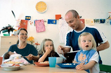 Family
at table eating Family at table eating