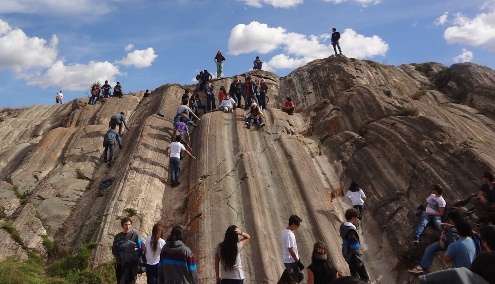 Natural broad
                                    slide by a rock formation 02,
                                    Sacsayhuaman near Cusco, Peru